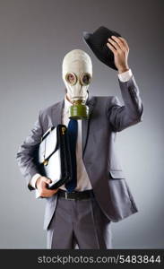 Businessman wearing gas mask