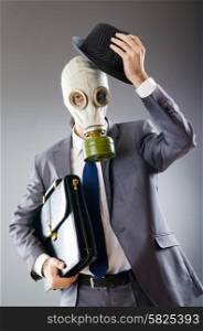 Businessman wearing gas mask