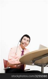 Businessman wearing headset and smiling