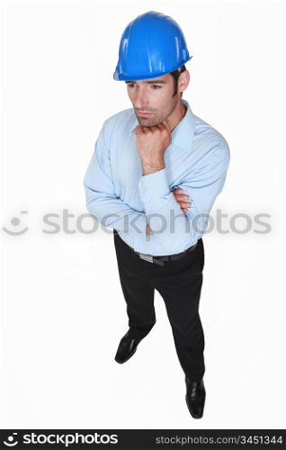 businessman wearing helmet and thinking