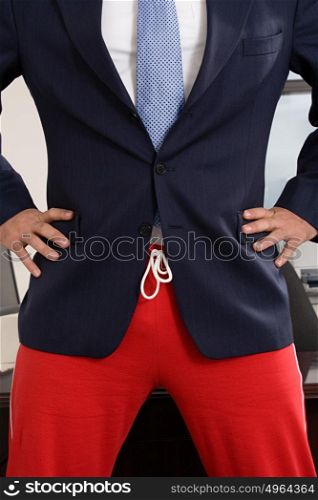Businessman wearing tracksuit bottoms