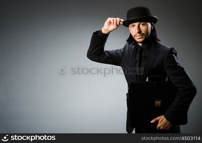 Businessman wearing vintage concept with briefcase