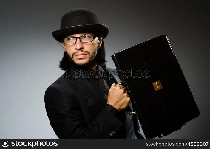 Businessman wearing vintage concept with briefcase