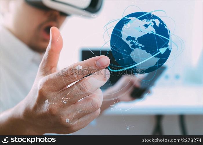 businessman wearing virtual reality goggles in modern office with mobile phone using with VR headset with world network diagram by NASA