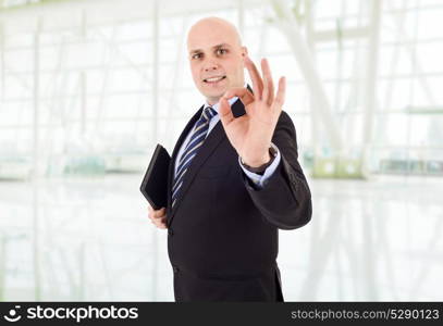 businessman winning, with a tablet pc, at the office