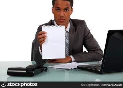 Businessman with a blank notebook