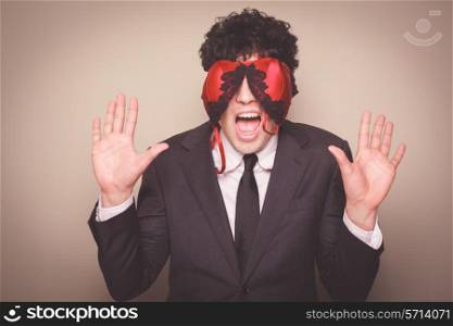 Businessman with a bra on his face