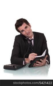Businessman with a diary and phone