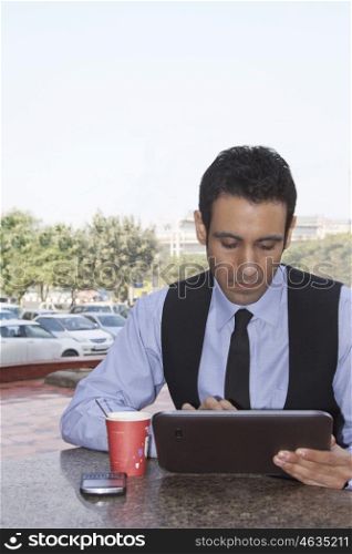 Businessman with a digital tablet , INDIA , DELHI
