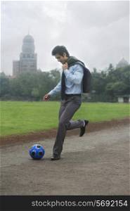 Businessman with a football