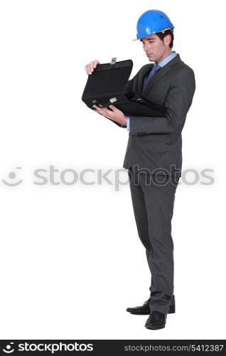 Businessman with a hardhat and a briefcase