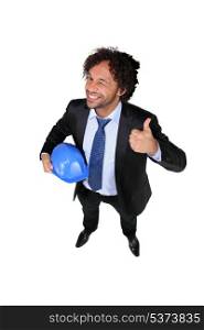 Businessman with a hardhat and the thumbs up