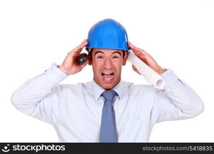 businessman with a helmet having a headache
