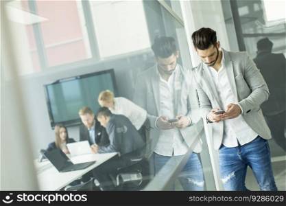 Businessman with a phone in the office