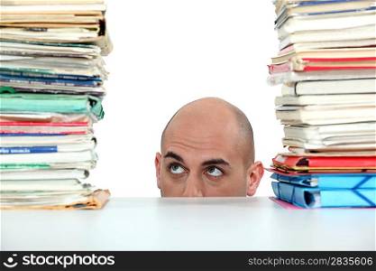 Businessman with a stack of paperwork