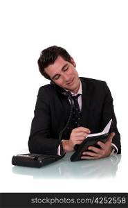 Businessman with a telephone and diary