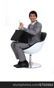 Businessman with an open briefcase
