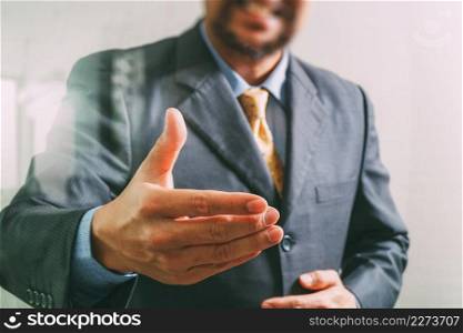 businessman with an open hand ready to seal business investor project deal,front view,filter effect