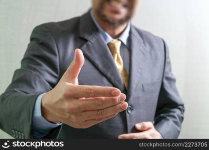 businessman with an open hand ready to seal business investor project deal,front view