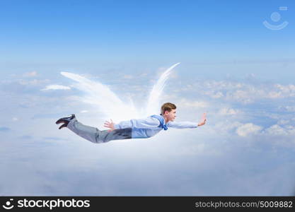 Businessman with angel wings. Young businessman with drawn wings flying in sky