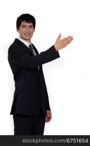 Businessman with arm stretched