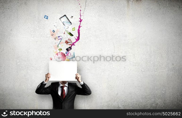 Businessman with banner. Unrecognizable businessman holding white blank paper. Place for text