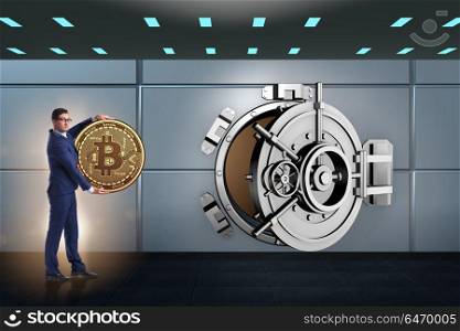 Businessman with bitcoin in front of vault door