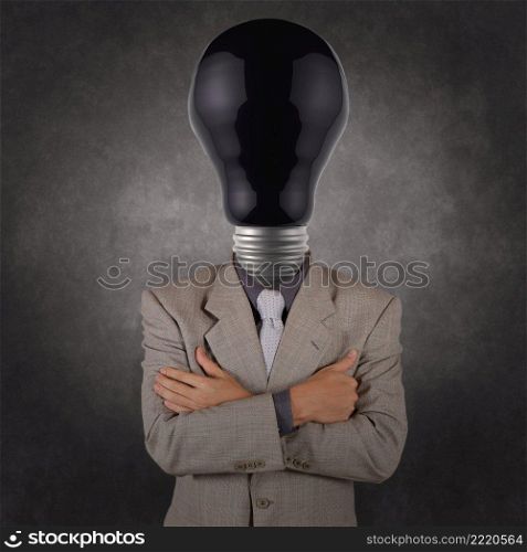 businessman with black light bulb head as concept