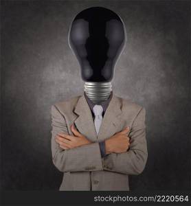 businessman with black light bulb head as concept