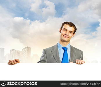 Businessman with blank banner