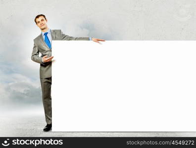 Businessman with blank banner. Businessman with blank banner. Place for text