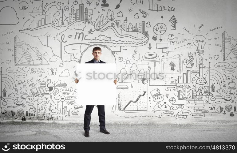 Businessman with blank banner. Young businessman showing blank signboard. Place for your text