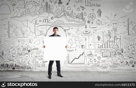 Businessman with blank banner. Young businessman showing blank signboard. Place for your text
