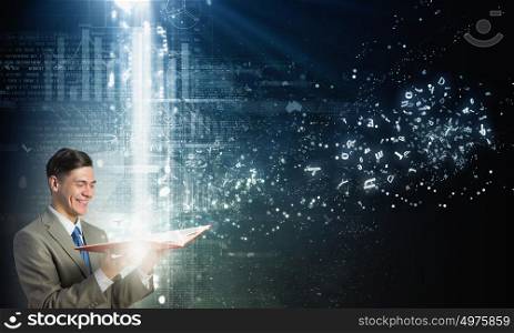 Businessman with book. Young businessman with opened book in hands and infographs on background