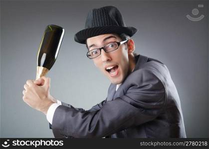 Businessman with bottle of champagne