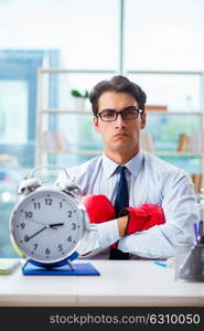 Businessman with boxing gloves in the office