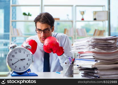 Businessman with boxing gloves in the office