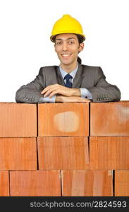 Businessman with bricks on white