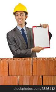 Businessman with bricks on white