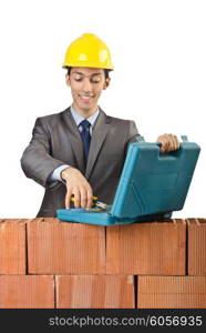 Businessman with bricks on white