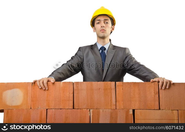 Businessman with bricks on white