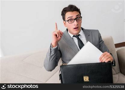 Businessman with briefcase in business concept