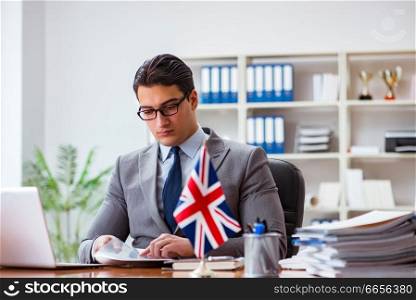 Businessman with British flag in the office