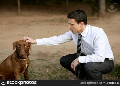 Businessman with brown dog outdoor in autumn park