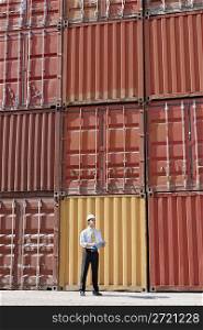 businessman with cargo containers