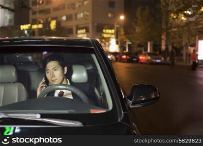 Businessman With Cell Phone In Car