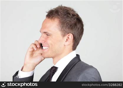 businessman with cell phone isolated