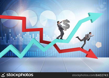 Businessman with charts of growth and decline