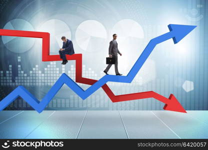 Businessman with charts of growth and decline