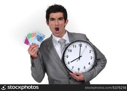 Businessman with clock and money